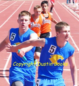One brother hands off to another in a track relay. Ask for "hand-Off."