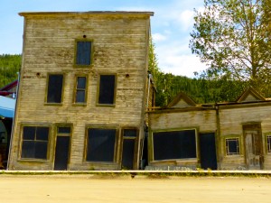 We're having a discussion in my hometown about building codes, but our needs clearly aren't as urgent as those of Dawson City, Yukon Territory, where the only thing holding these two buildings upright is each other.